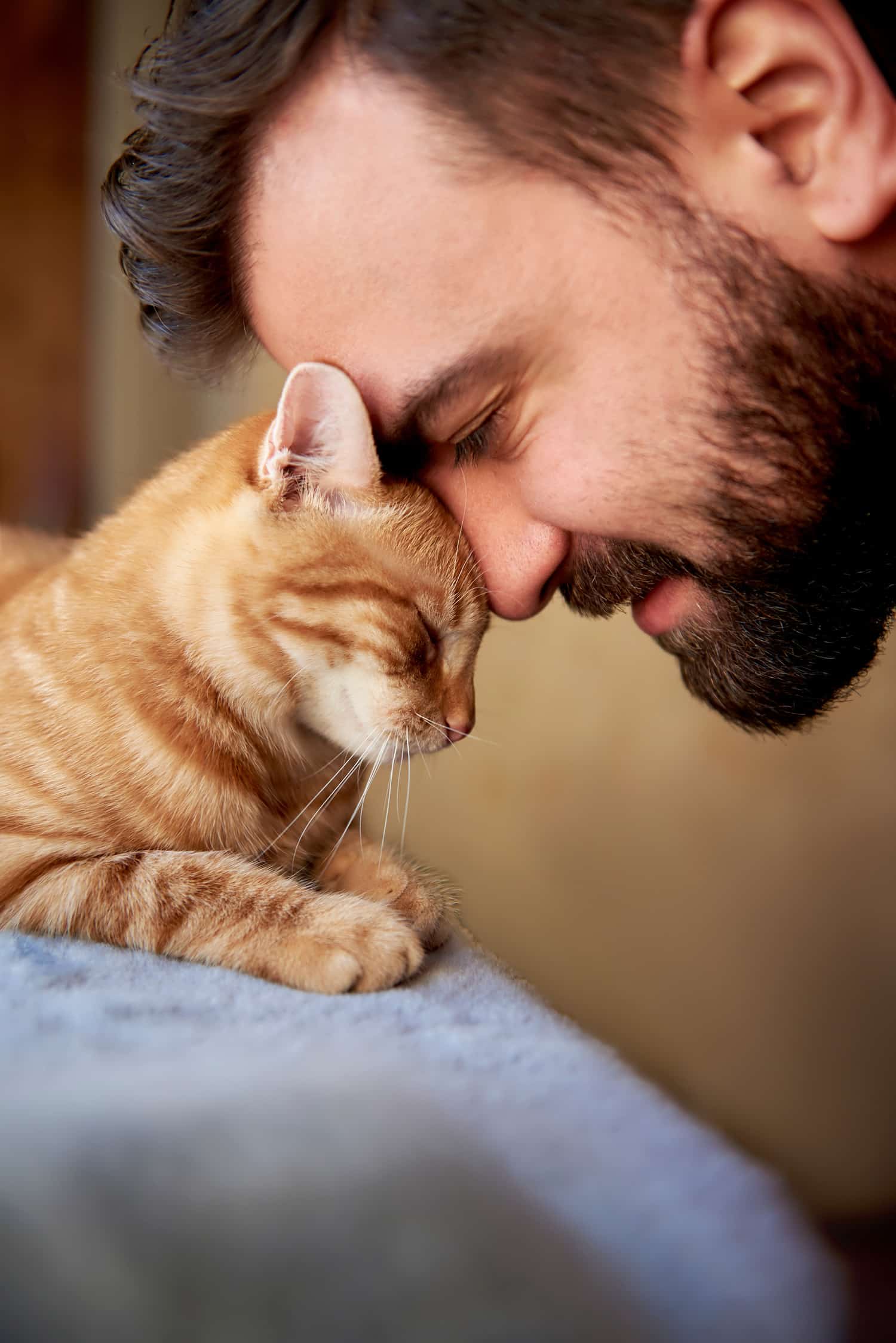 Man snuggles his cat at the veterianry vaccine clinic in Tuscon AZ